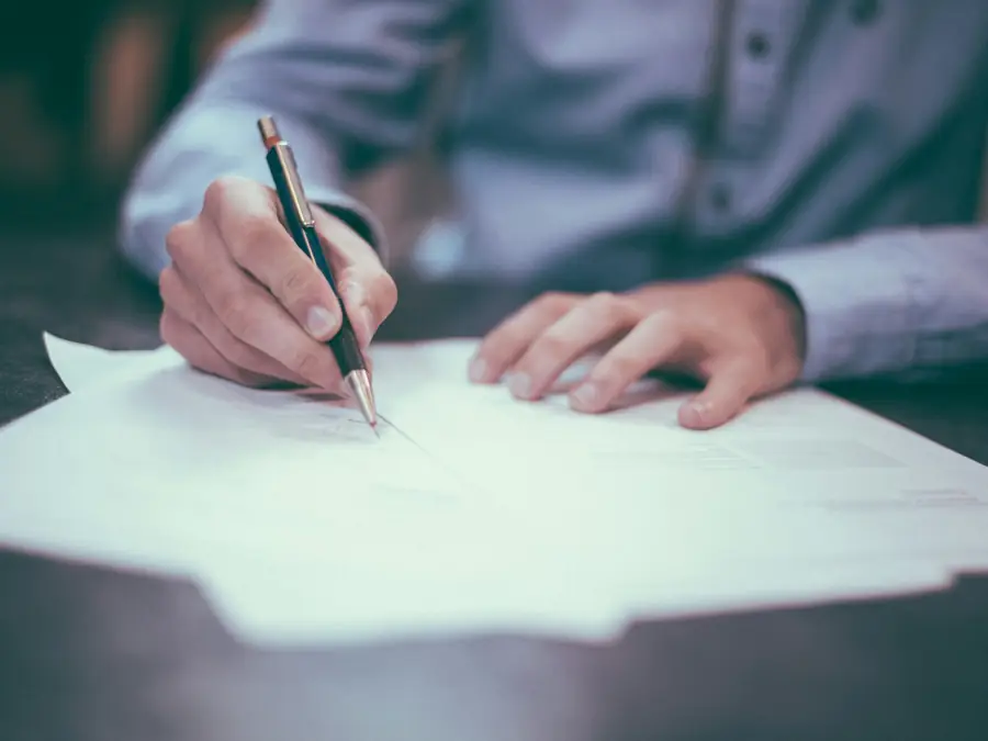 A report being signed off at the close of an engagement