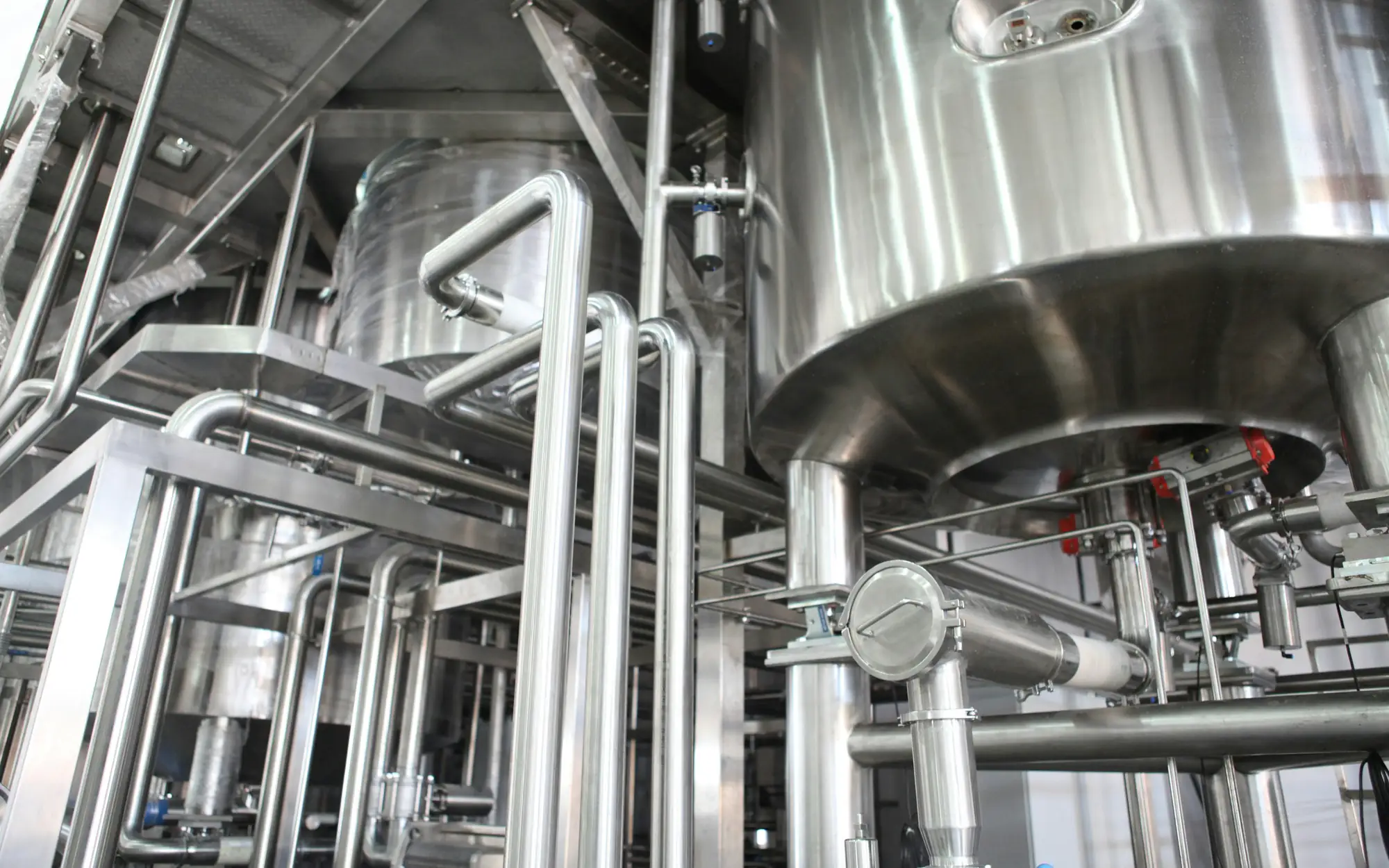 Stainless steel process vessels and piping in a pharmaceutical manufacturing plant